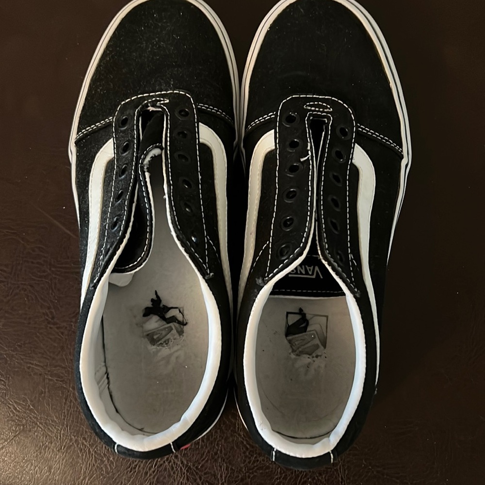 Vans low top lace up sneaker. Gently worn, will need new laces. Size 9.